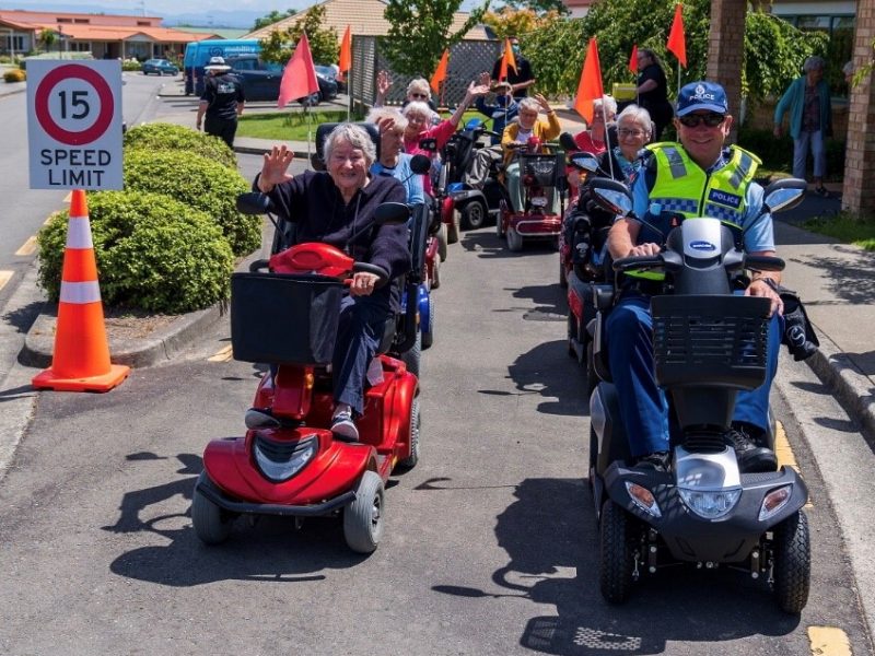 Informative image showing a group enjoying mobility scooter training